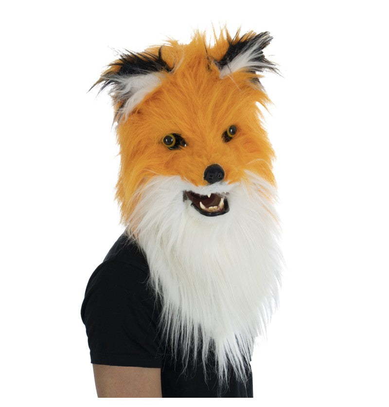 The image shows a fox-themed party mask with faux fur and an articulated mouth, designed to cover the upper part of the face and nose.