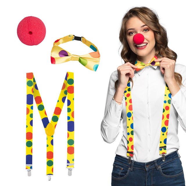 Clown costume accessory set for adults featuring a red clown nose, colorful bow tie, and suspenders, ideal for circus-themed parties and events.