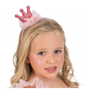 The image shows a pink glittery crown headband, designed as a party accessory.