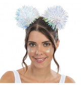 The image shows a headband accessory featuring two iridescent pom-poms attached to springs, designed for party wear.